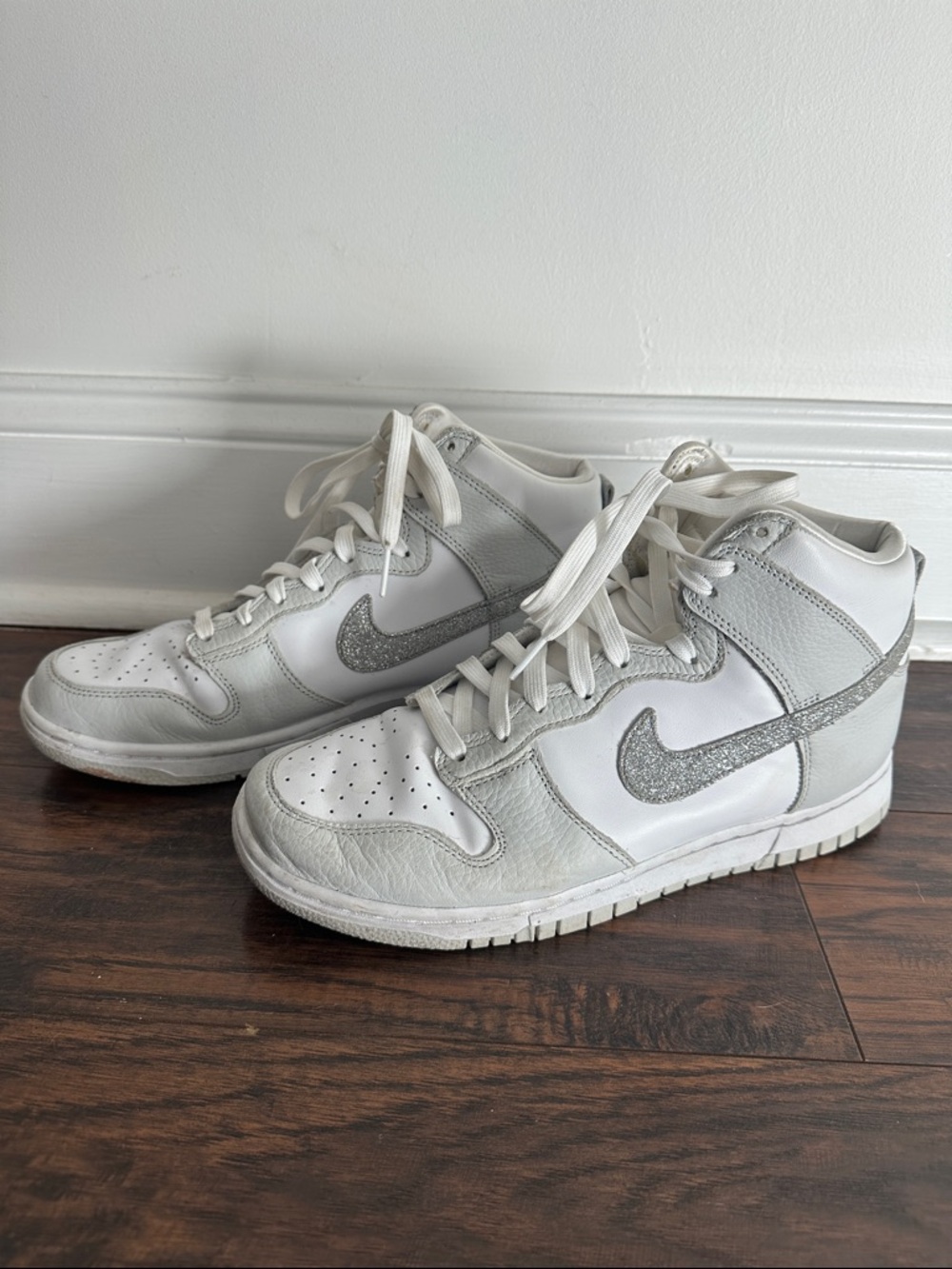 Nike White High-Top Sneakers with Silver Glitter Swoosh